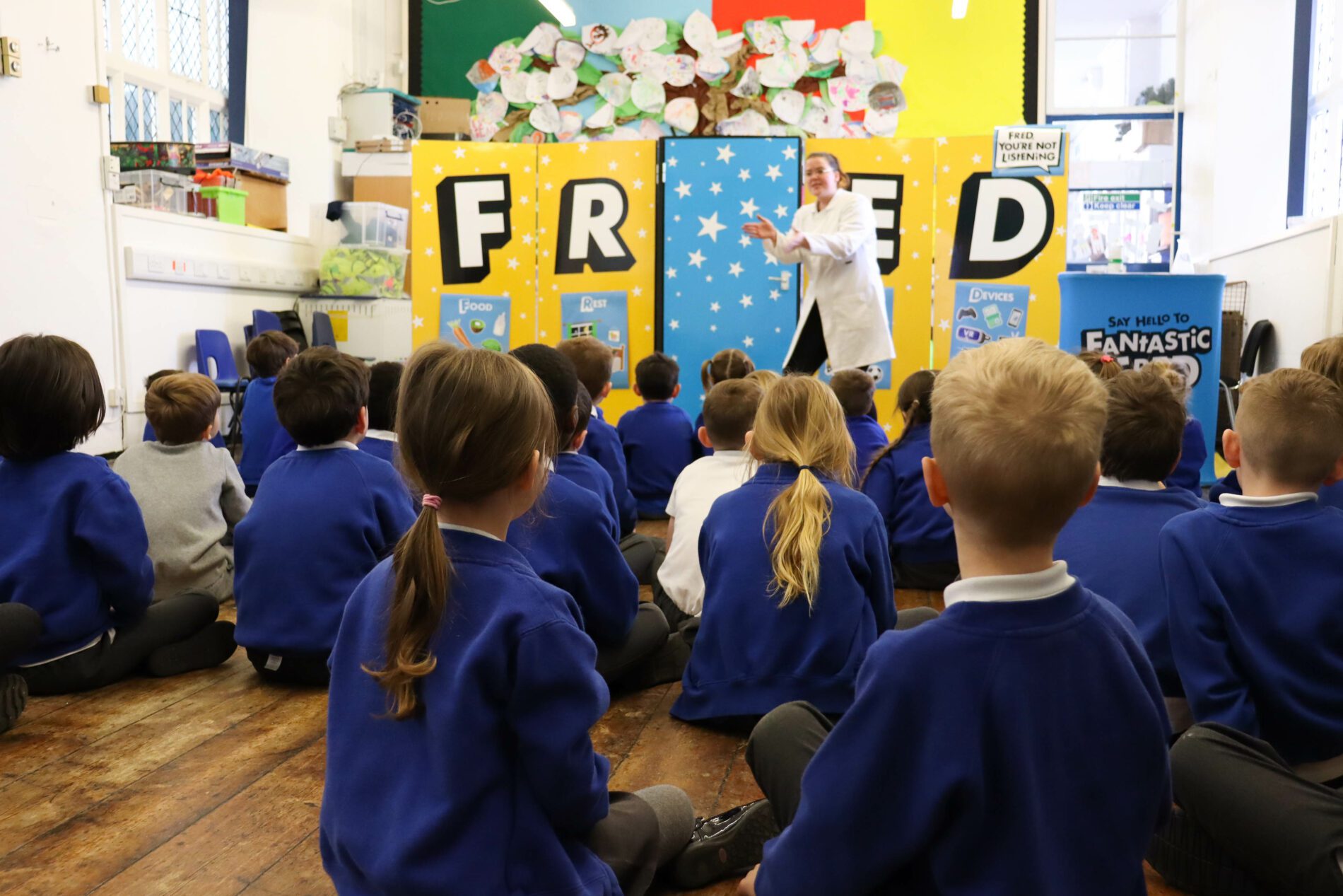 IMG_1189 sedleys primary school pupils sat on the hall floor listening to a talk from a company called FRED
