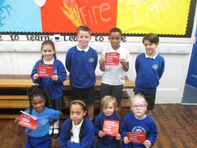 group of pupils supporting show racism the red card flyers