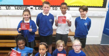 group of pupils supporting show racism the red card flyers