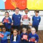 group of pupils supporting show racism the red card flyers