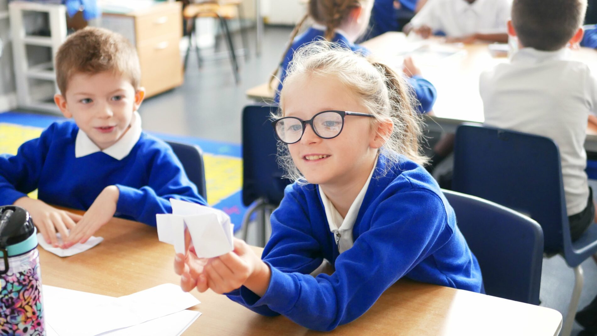 P1160606 pupil smiling at folded paper origami