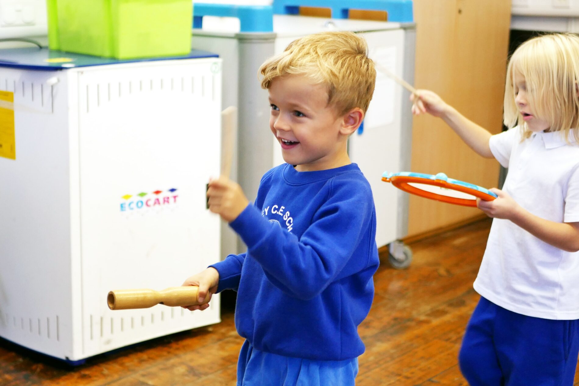 P1170014 pupil playing wooden musical instrument in hall at sedleys primary school