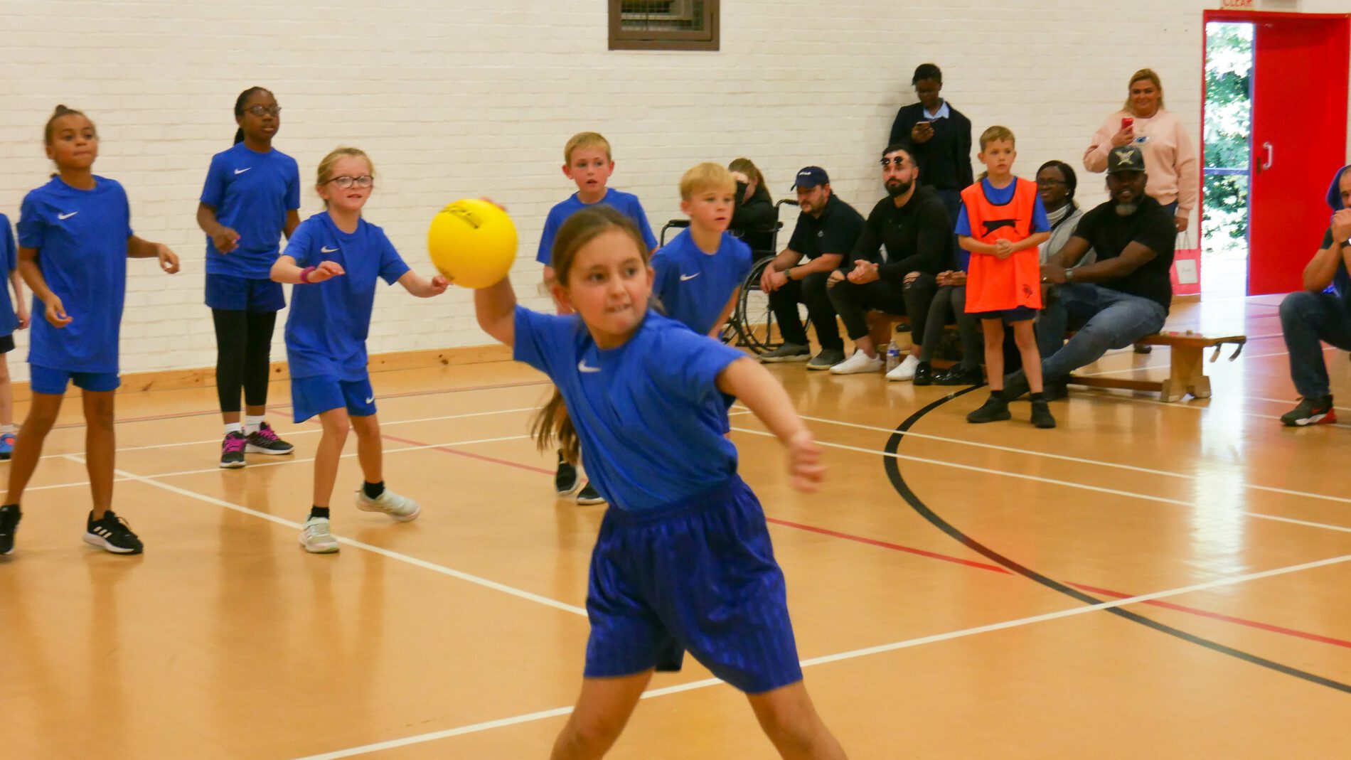 P1190050 sedleys dodgeball team playing in tournament in sports hall, young girl at forefront throwing a ball