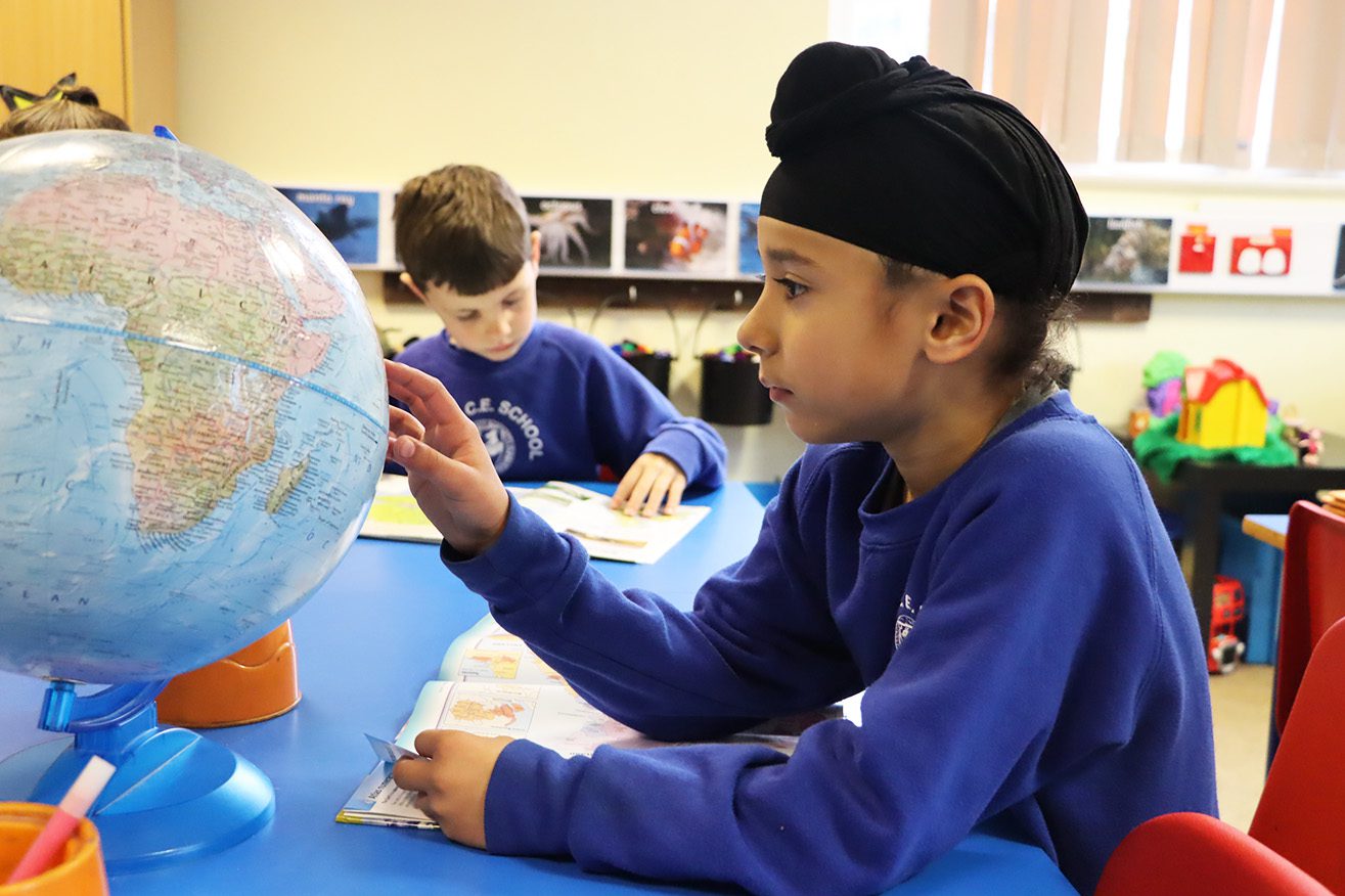 pupil looking at a globe