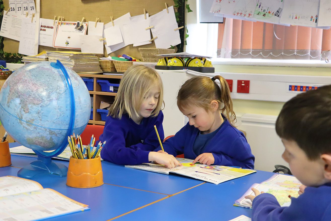 IMG_3150 two pupils working together looking at an atlas