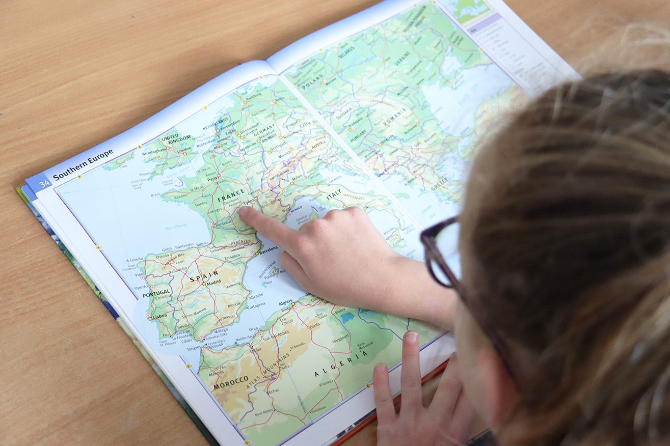 IMG_8538 pupil pointing at france in an atlas