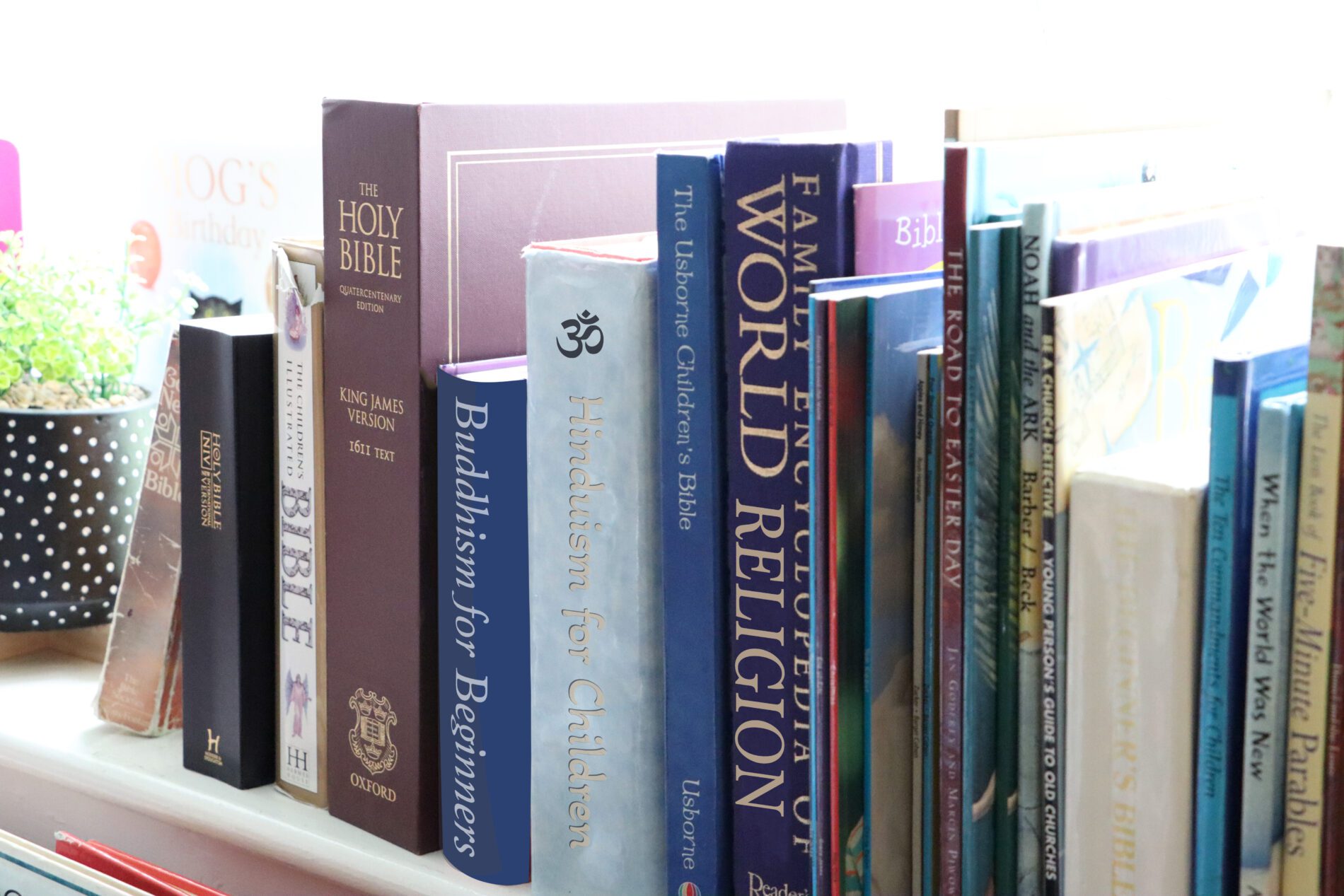 collection of religious books on a shelf